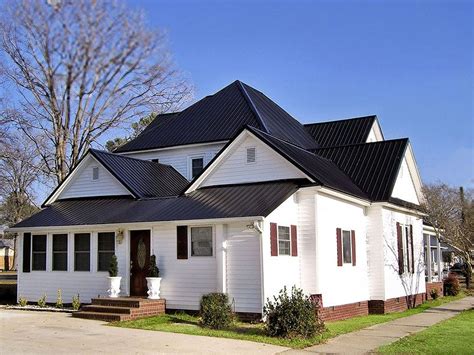 black metal roof white house|sloped roof fbi.